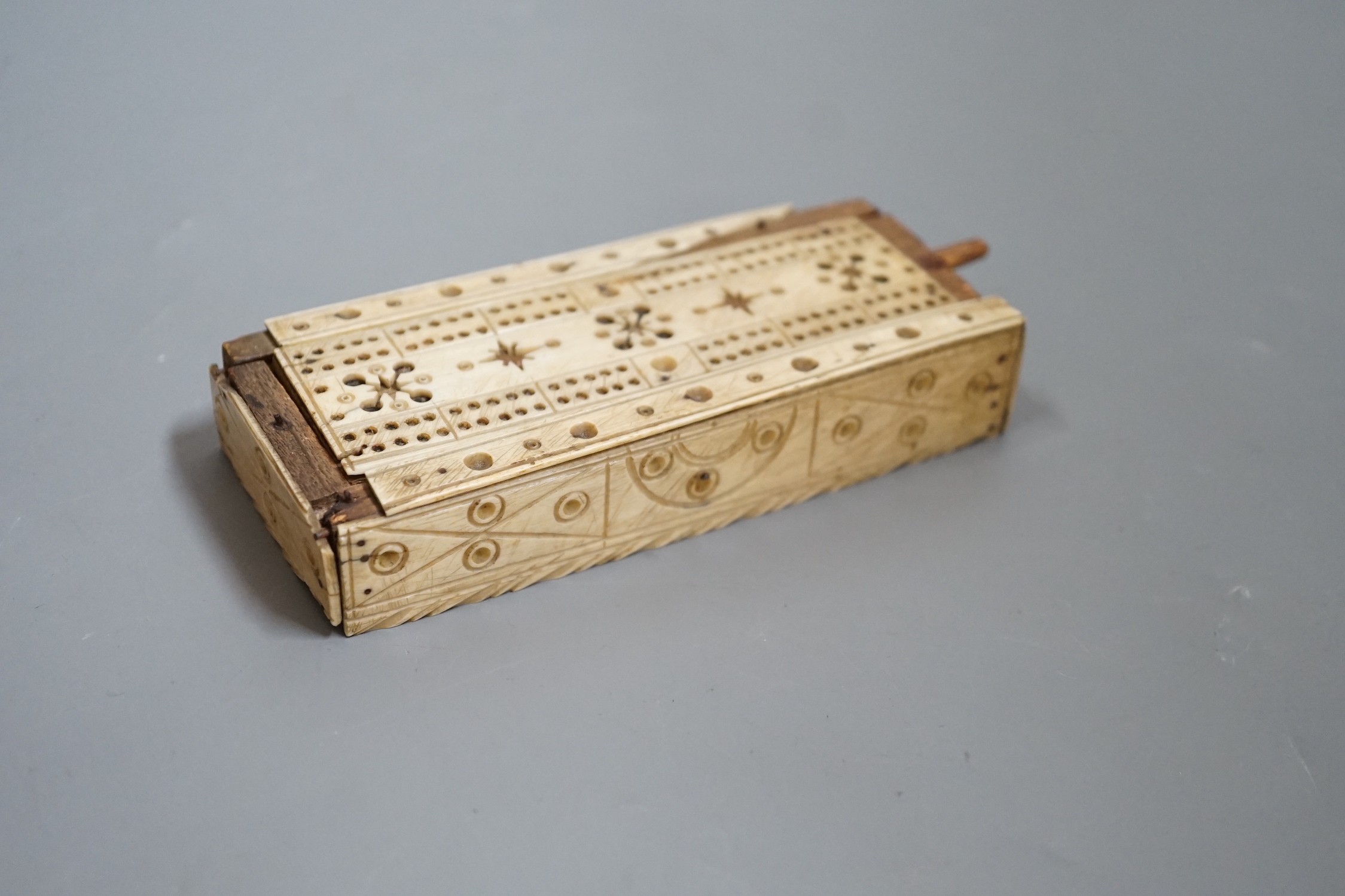 A Napoleonic Prisoner of War bone domino set, box 14cm wide